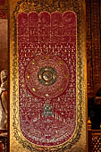 Chiang Mai - The Wat Phra Singh temple. The small Viharn Lai Kham (Gilded Hall), Buddha footprint. 